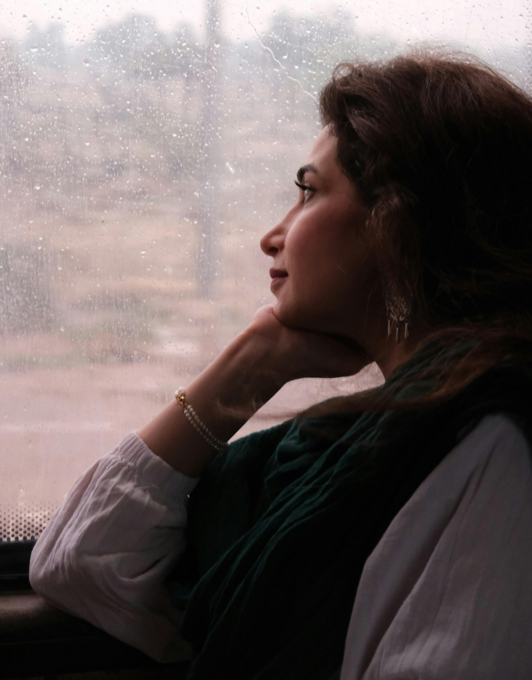 woman looking out the window